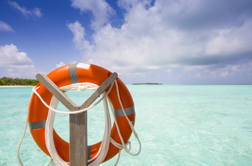 A beautiful travel destinations and tropical beach with a buoy in the foreground.